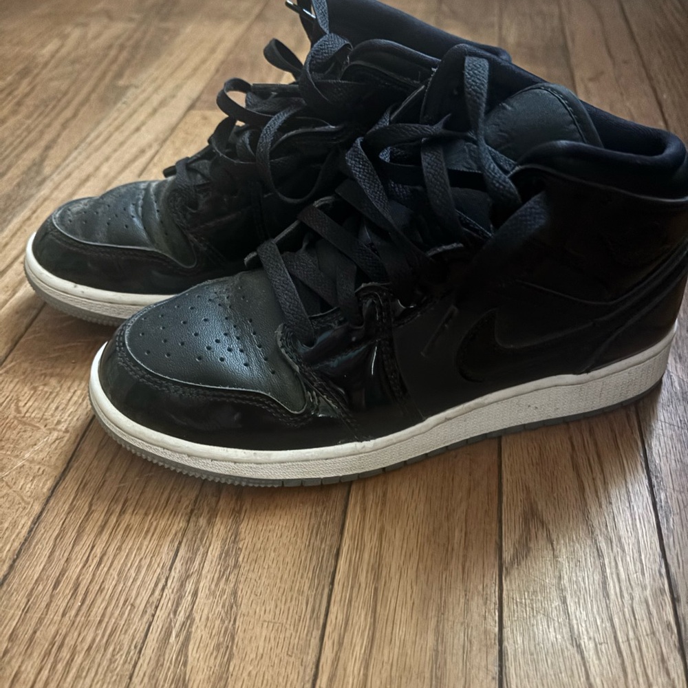Youth black Nike Jordans
